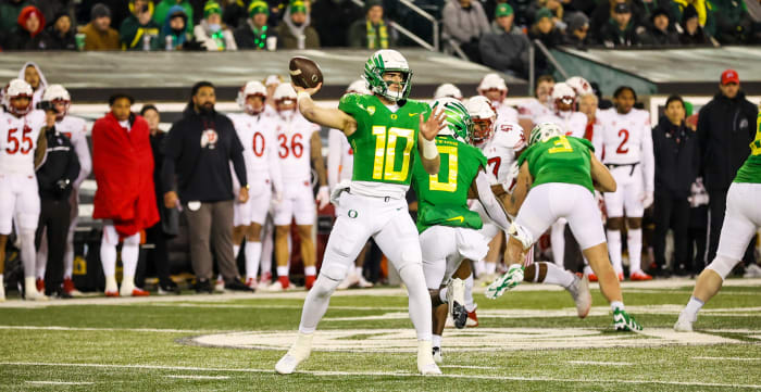 Oregon Quarterback Bo Nix throws a pass in the pocket.